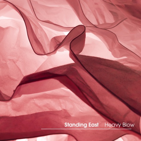 Standing East – Heavy Blow